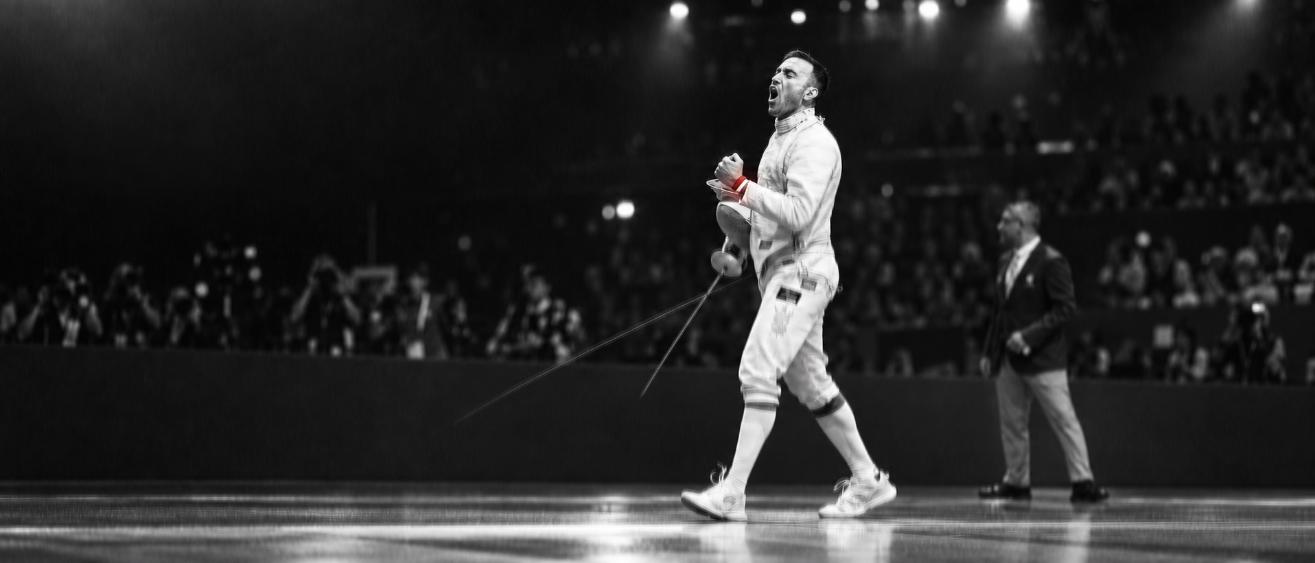 Ali Pakdaman celebrating a touch on the fencing piste