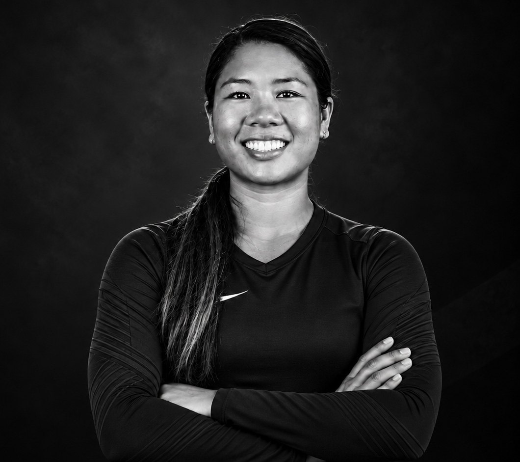 Black and white portrait of volleyball player Justine Wong-Orantes, arms crossed